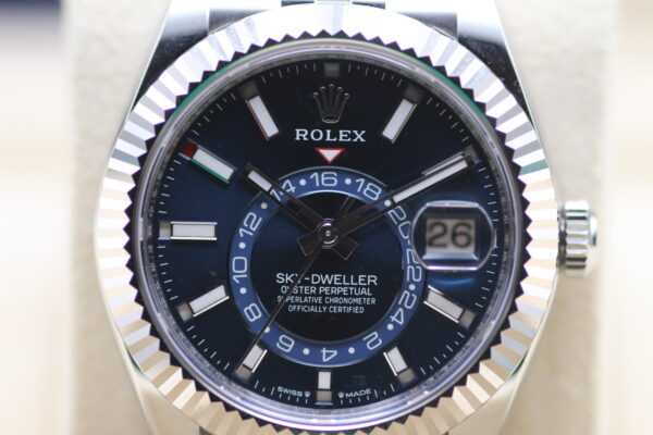 A Close up picture of a Rolex Sky Dweller Blue Dial reading 10 past 10