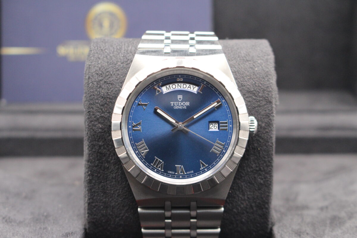 A Blue dial Tudor Royal Day Date sat upright in its box reading 10 past 10