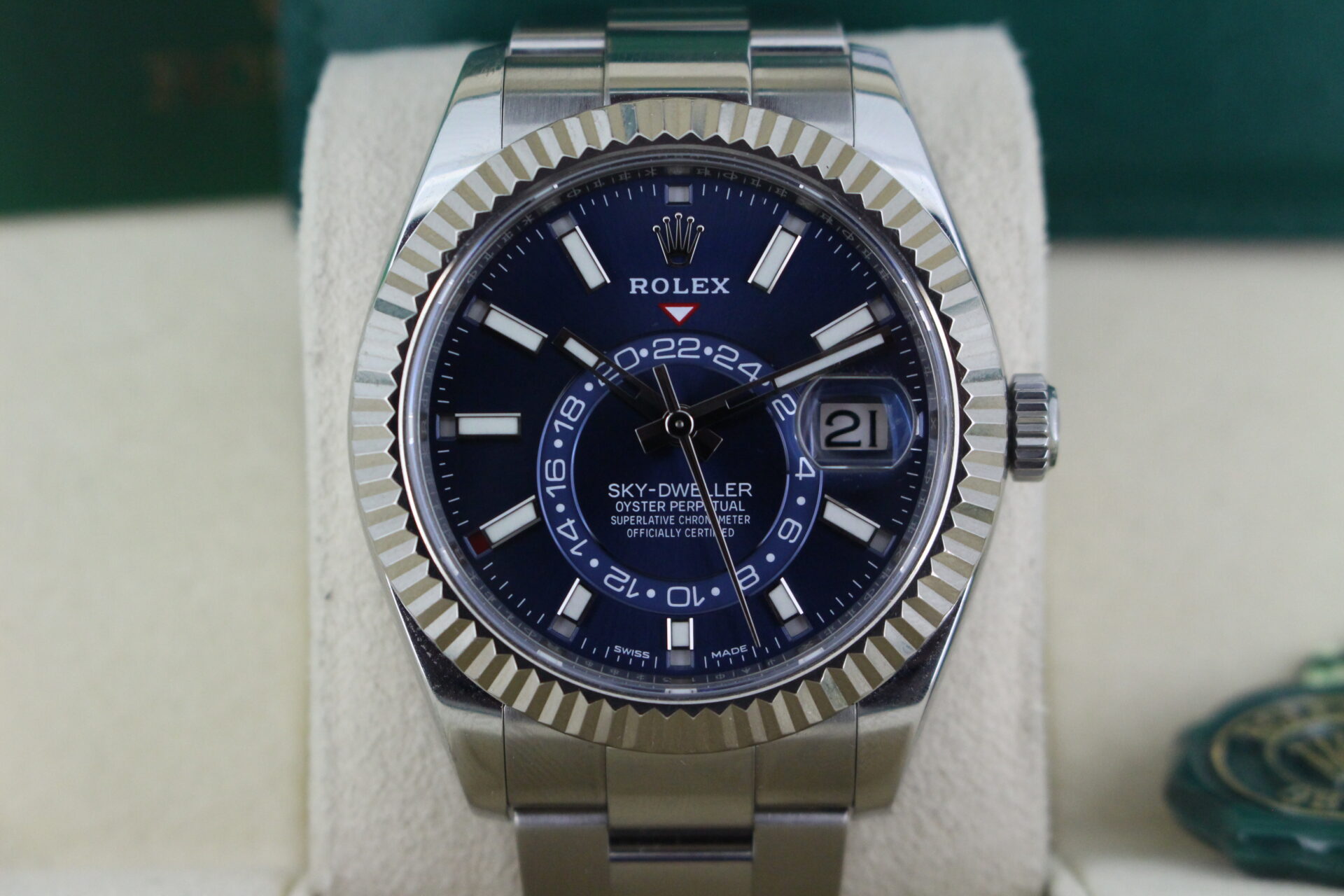 Close up of Rolex Sky-Dweller Blue Dial 326934 in it's box with green swing tag, booklets and warranty card