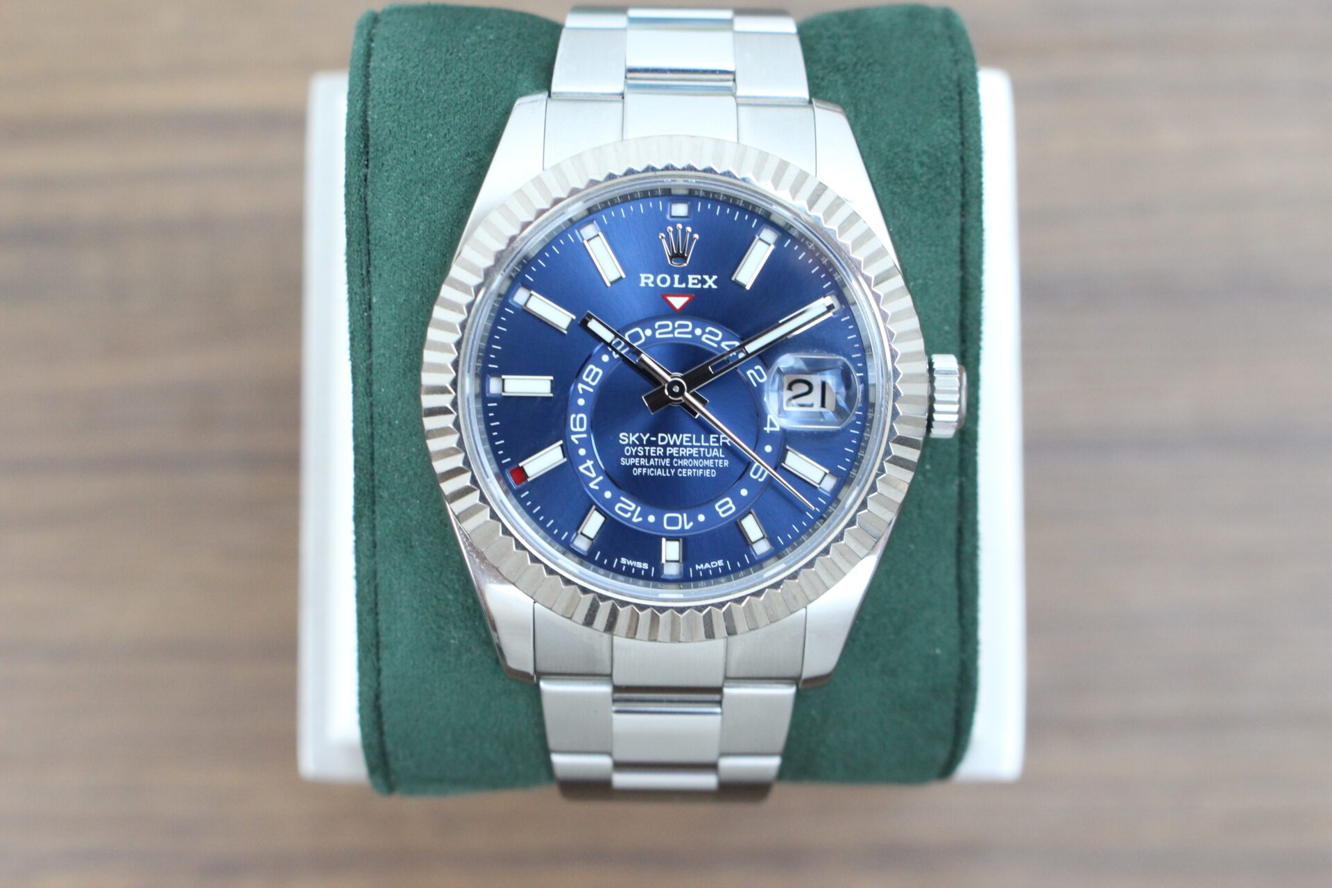 Rolex Sky-Dweller Blue Dial 326934 on a green cushion