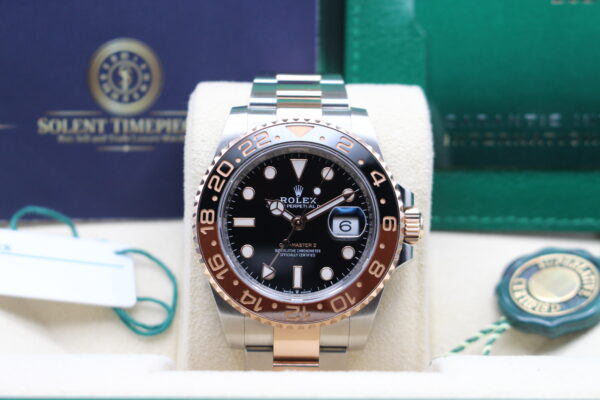 Rolex rootbeer in its box with all accessories creating a full set