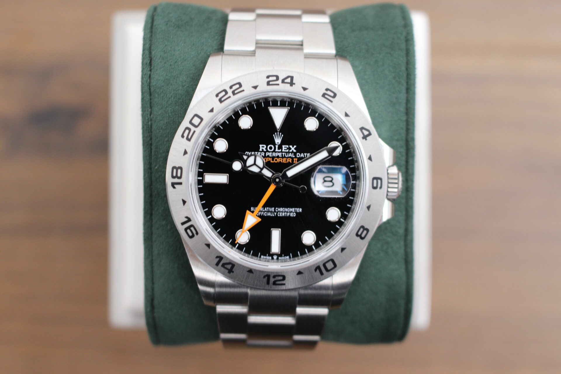 Rolex Explorer II 226570 on a green cushion