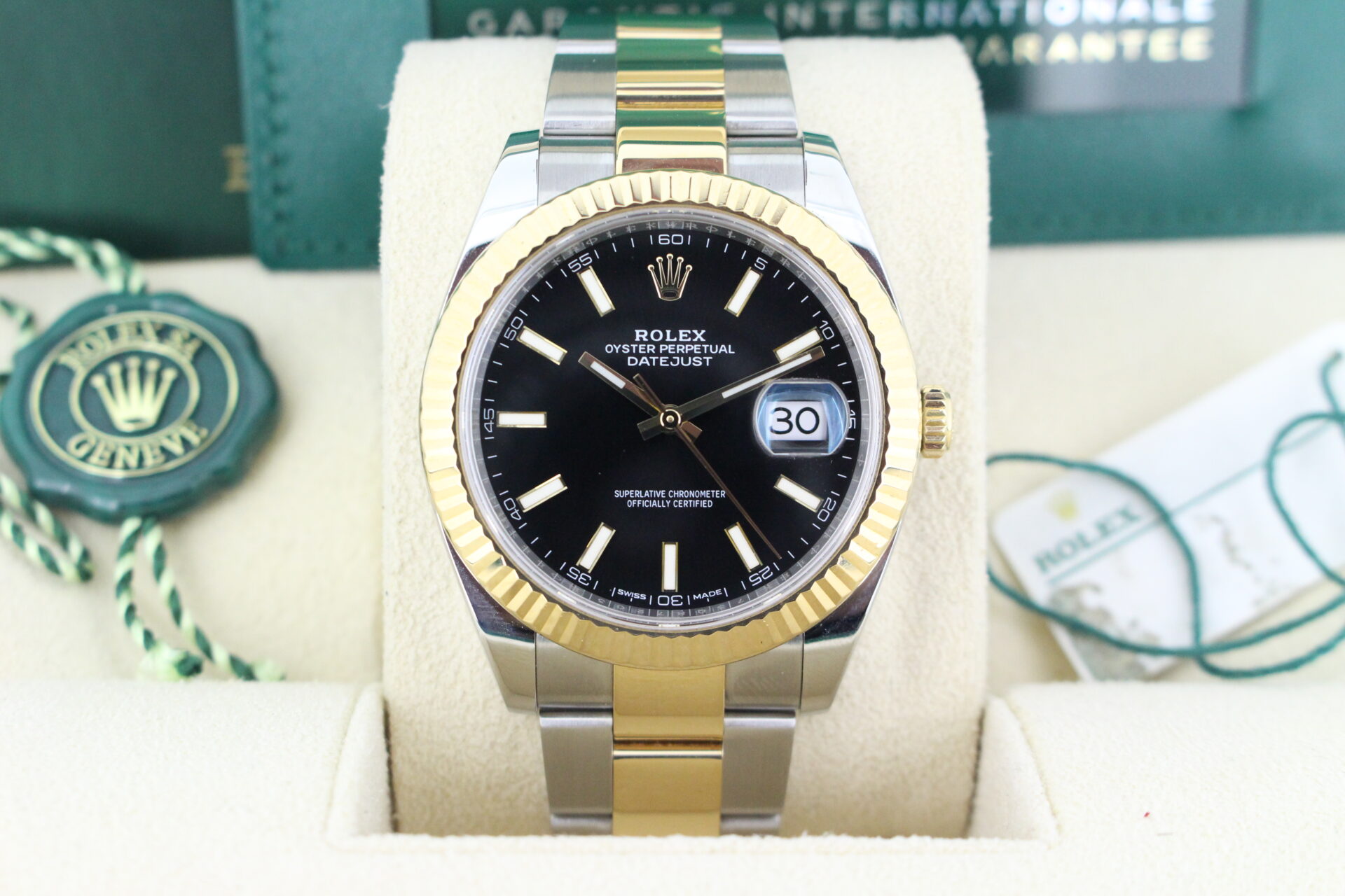 Close up of Rolex Datejust 41mm 126333 in it's box with both swing tags, booklets and warranty card