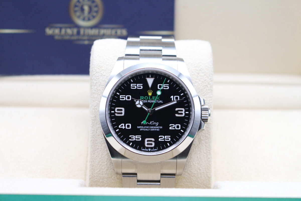 Rolex Air-King on its cushion sat upright inside its box. Solent Timepieces Logo in the background