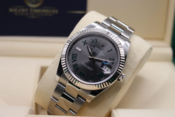 Rolex Datejust 41mm on its watch cushion. Displayed at an angle showing off the Wimbledon Dial