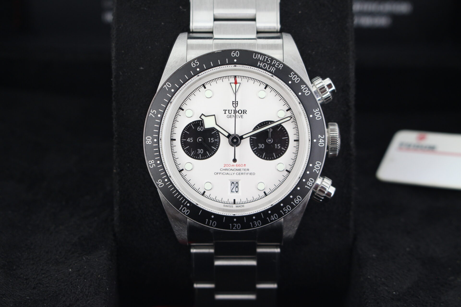 Close up of Tudor Black Bay Chrono Panda M79360N in it's box with swing tag, booklets and warranty card