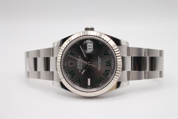 Rolex Datejust 41mm laid on its side on a white background with fitted a Wimbledon