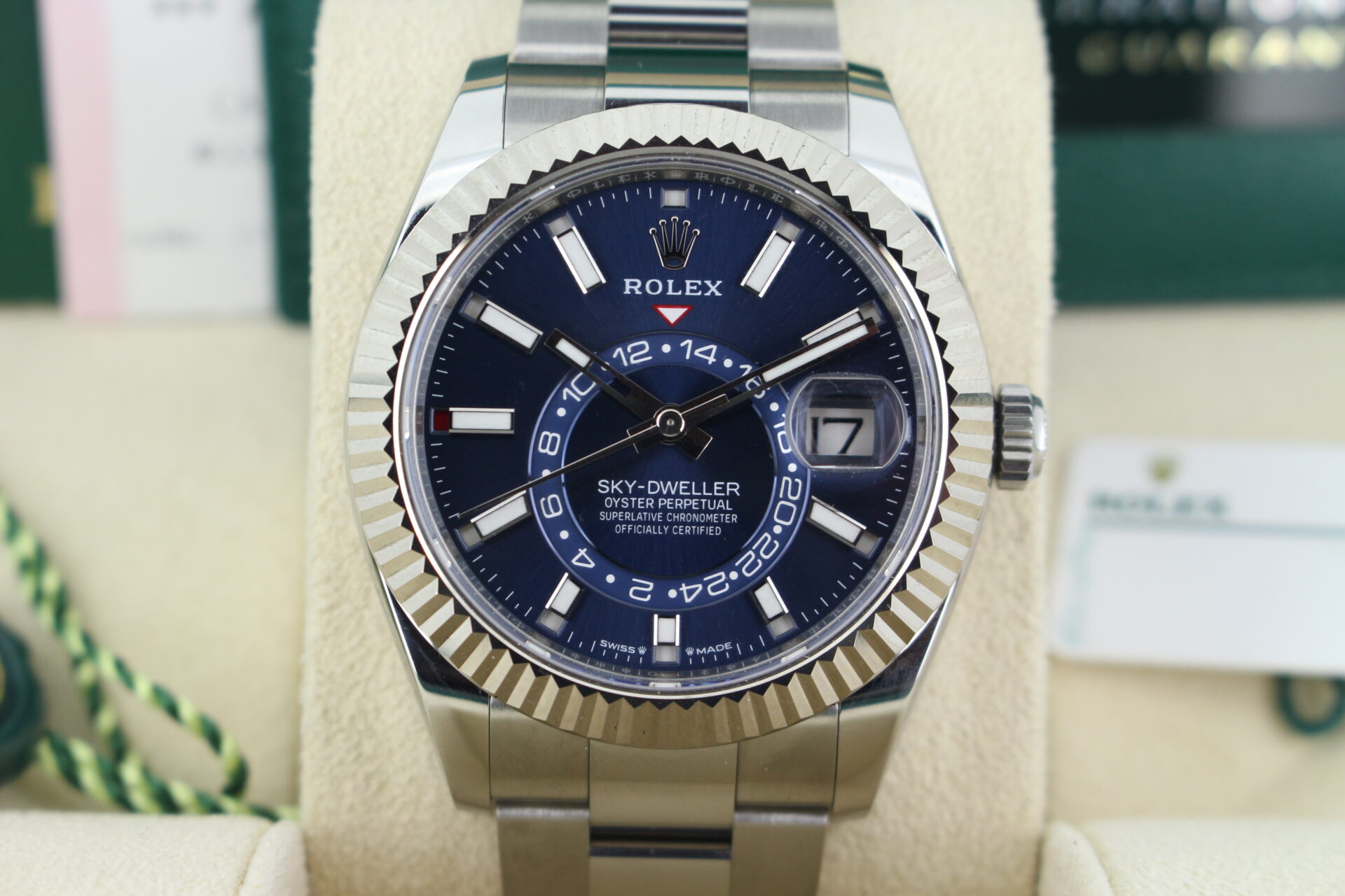 Close up of Rolex Sky-Dweller Blue Dial 336934 in it's box with both swing tags, original purchase receipt, booklets and warranty card