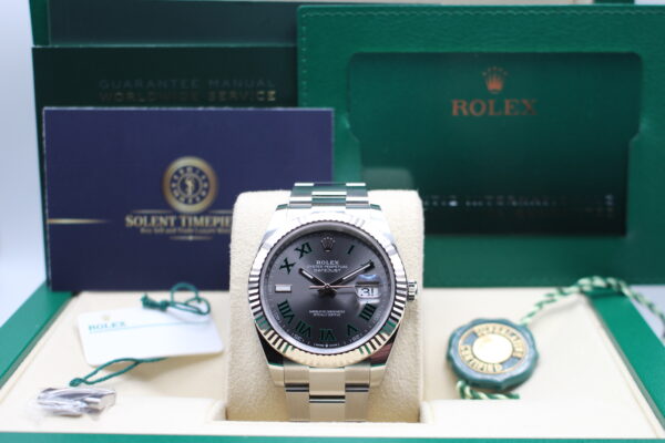 Rolex Datejust 41mm fitted with a Wimbledon dial and fluted bezel. On display in its box with all original accessories making a full set.