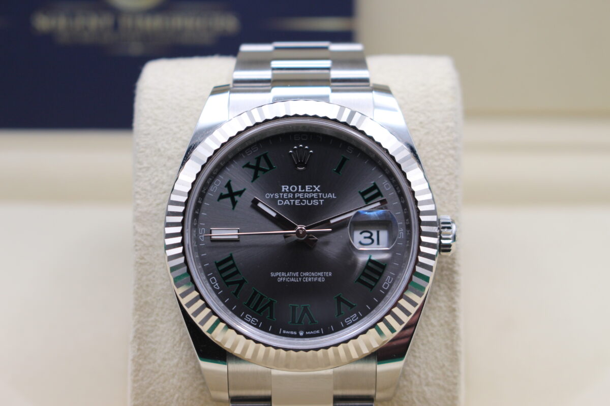 Rolex 126334 Wimbledon on an oyster bracelet sat on its cushion. Close up shot of the dial