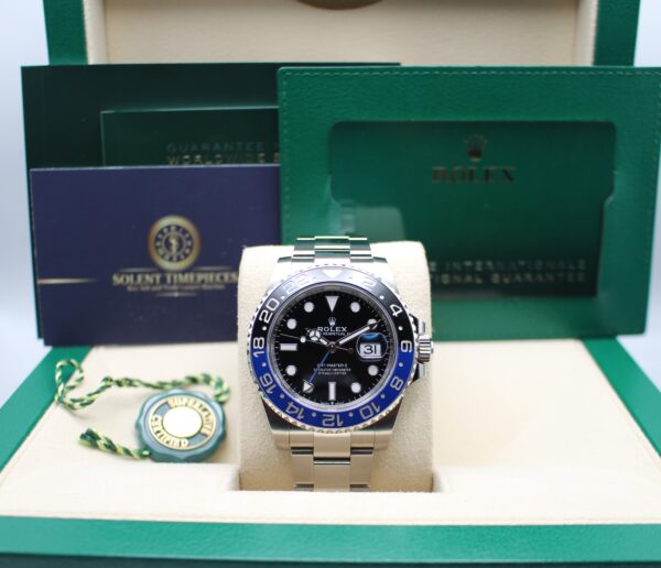 Rolex GMT Master II with a black and blue bezel. On display in a Rolex box with all original accessories making a full set