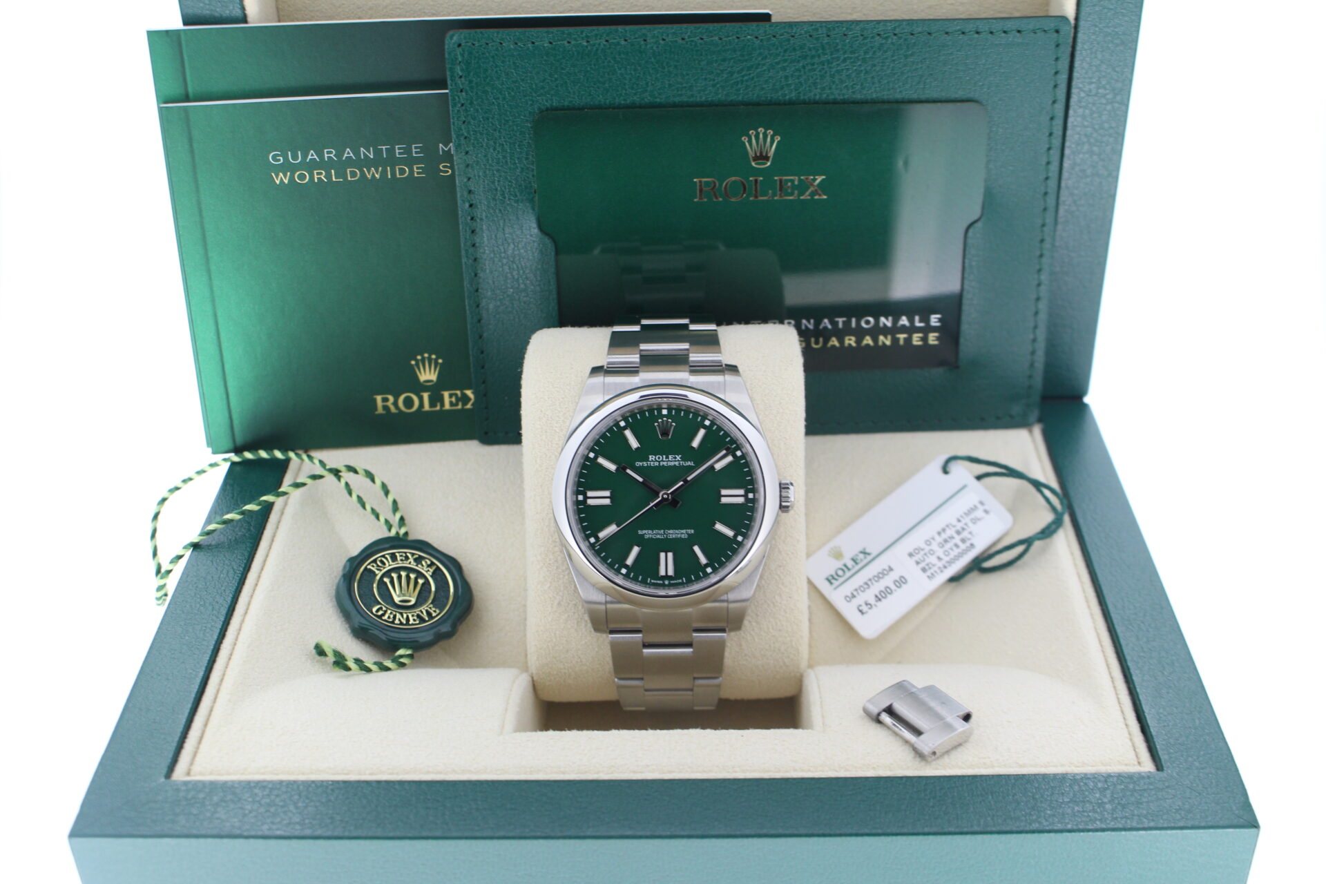 Rolex Oyster Perpetual 41 Green 124300 in it's box with both swing tags, booklets and warranty card