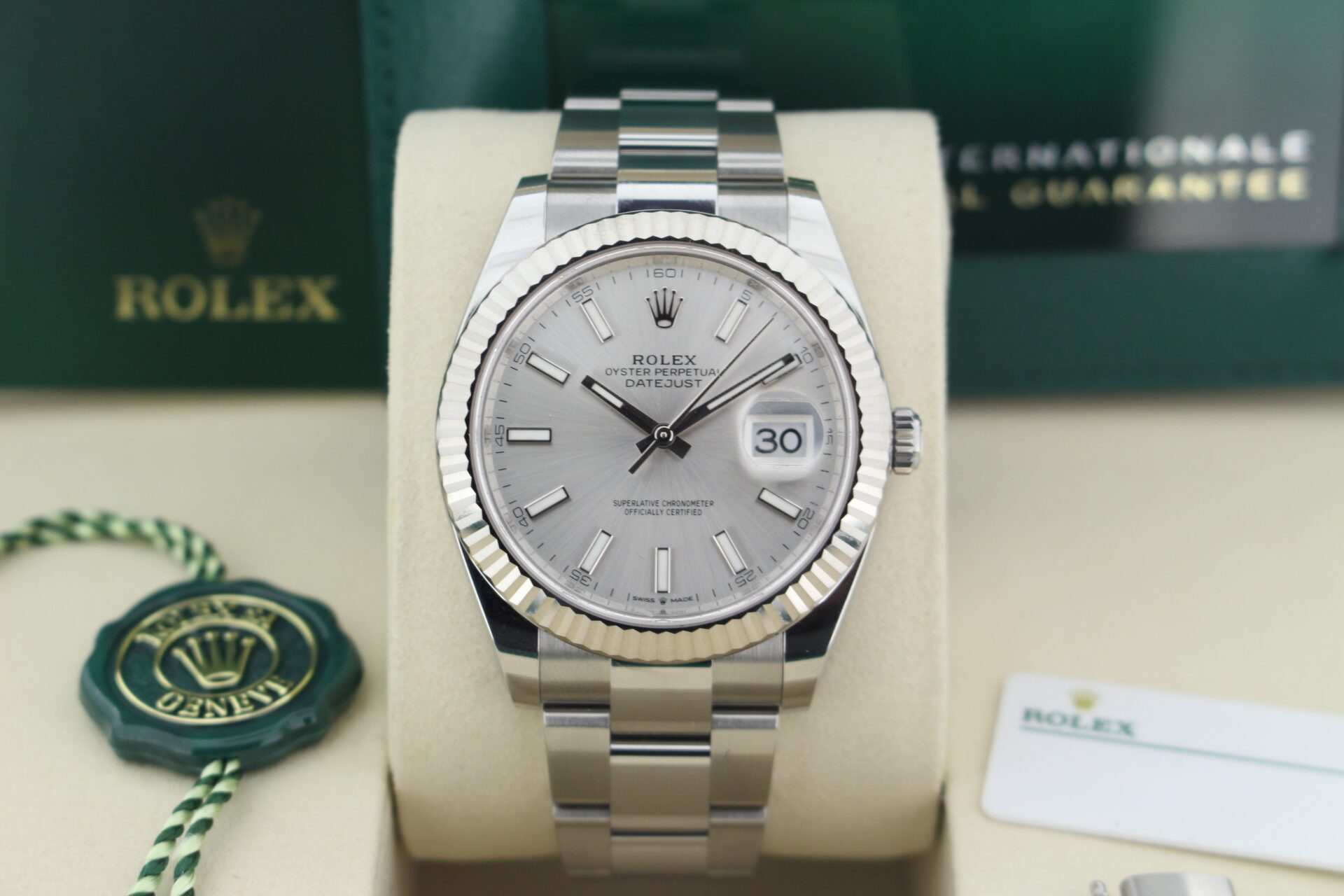 Close up of Rolex Datejust 41 Silver 126334 in it's box with both swing tags, booklets, original purchase receipt and warranty card