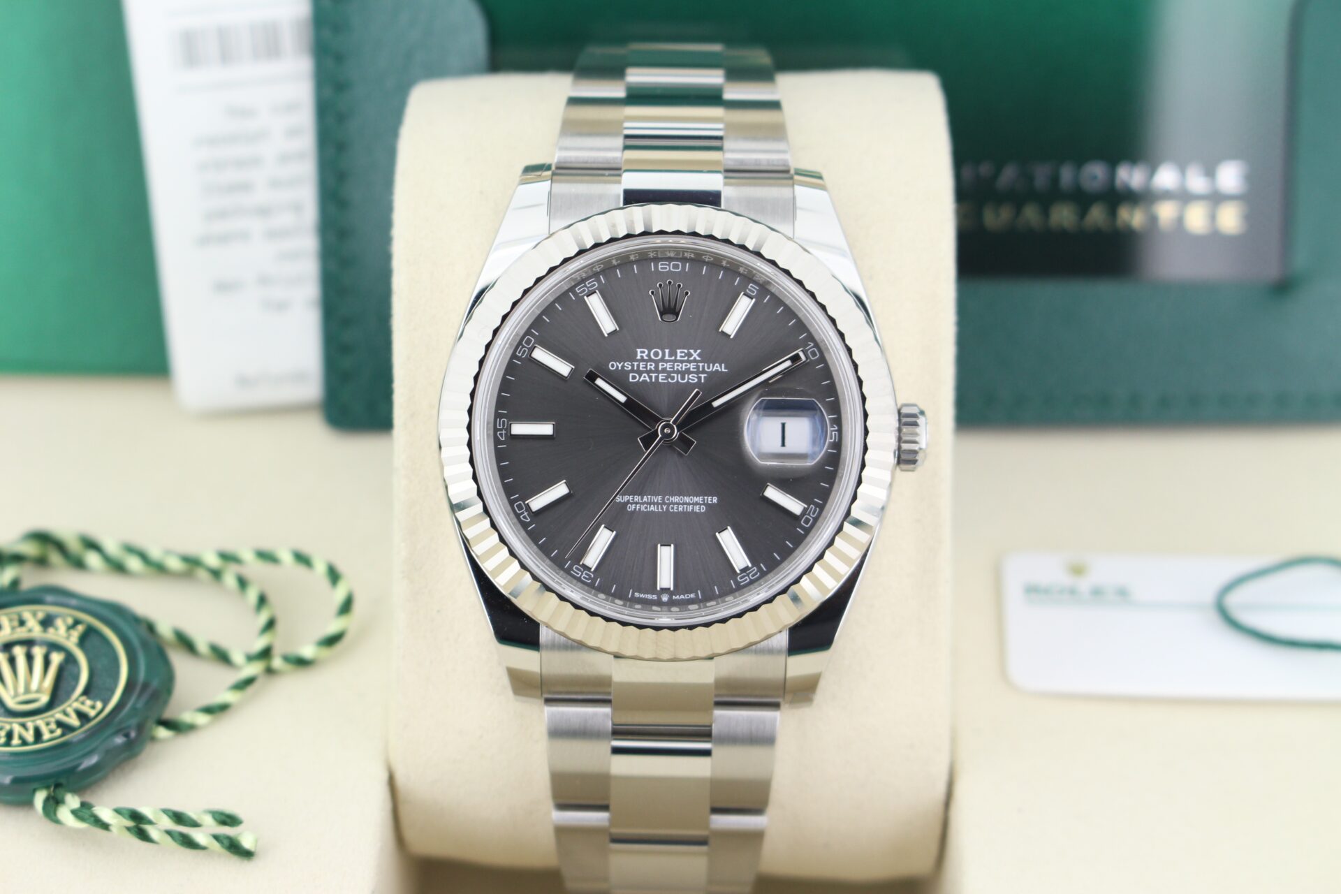 Close up of Rolex Datejust 41 Slate Grey 126334 in it's box with both swing tags, booklets, original purchase receipt and warranty cards