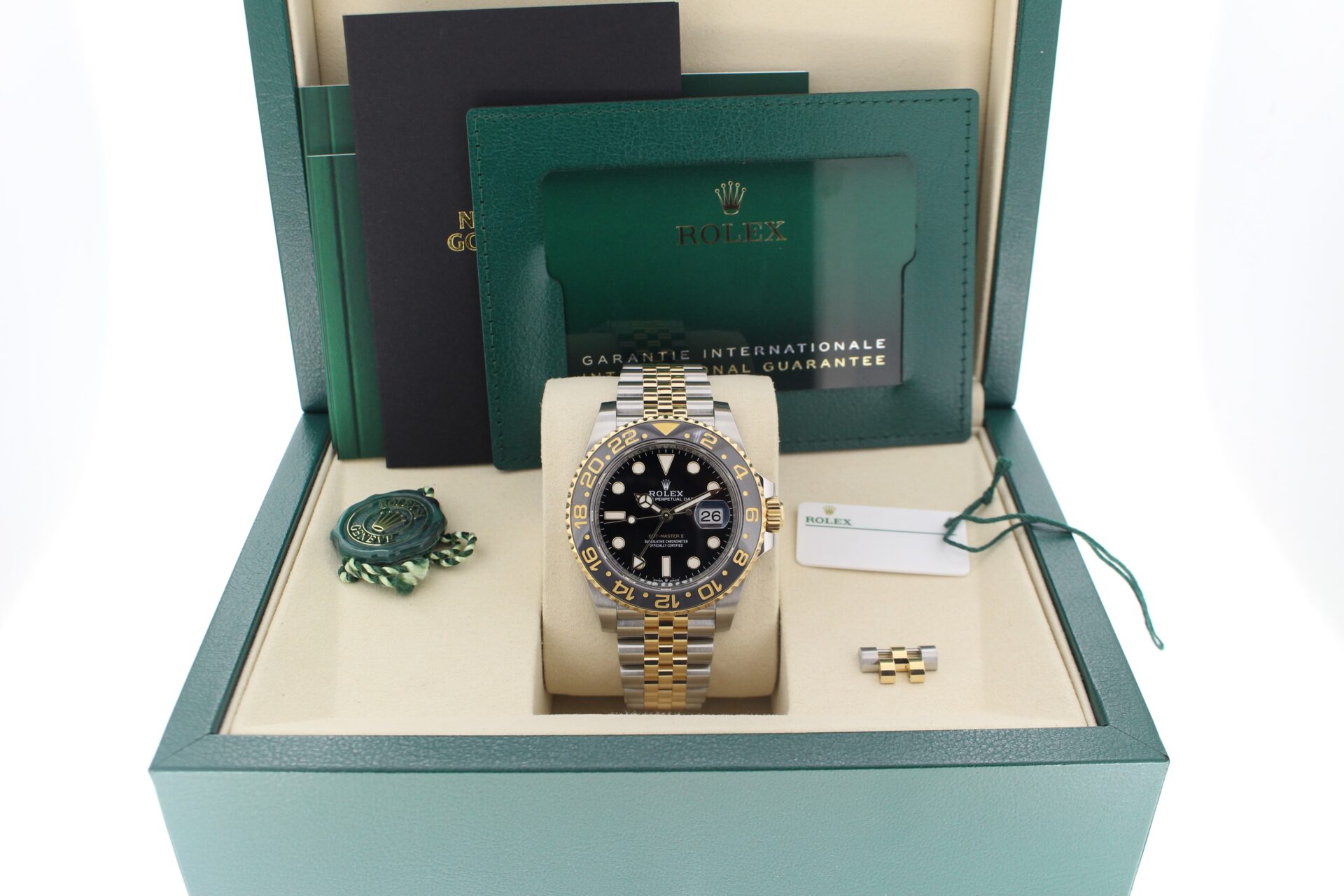 Rolex GMT Master II Zombie 126713GRNR in it's box with both swing tags, booklets, original purchase receipt and warranty card