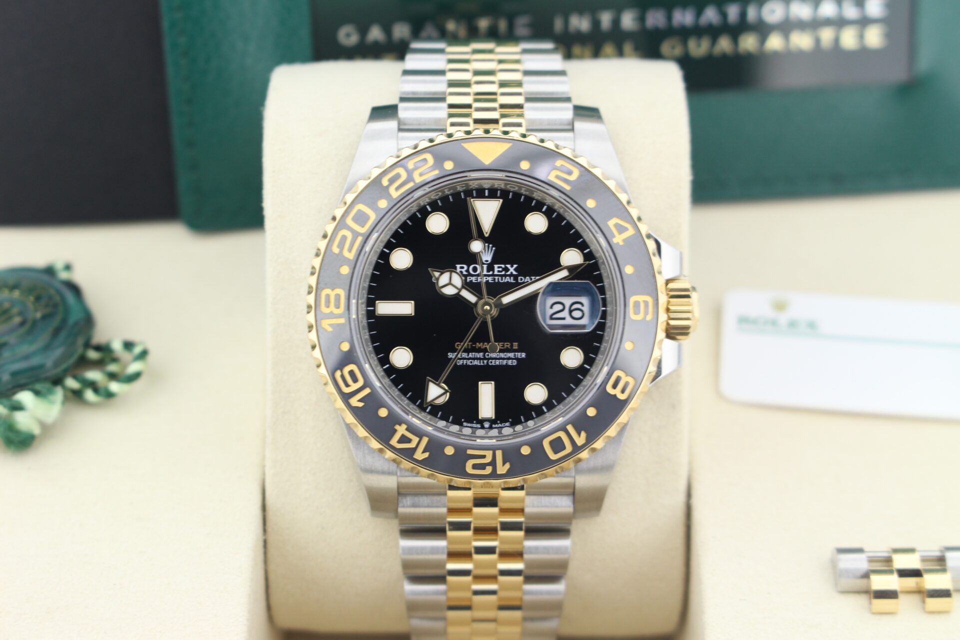 Close up of Rolex GMT Master II Zombie 126713GRNR in it's box with both swing tags, booklets, original purchase receipt and warranty card