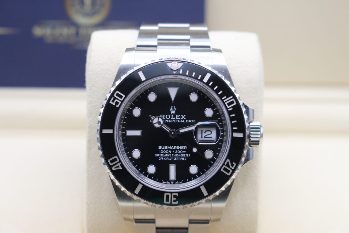 Rolex Submariner date sat upright on its watch cushion