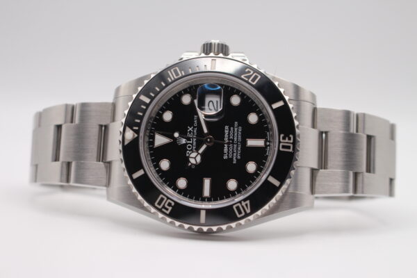 Rolex 126610LN Submariner date laid on its side crown facing up. on a white background