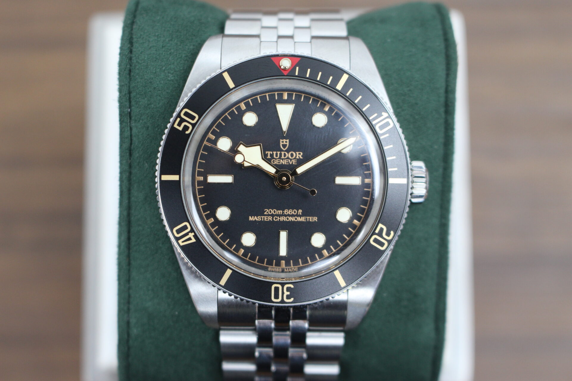 Tudor Black Bay 58 7939A1A0NU on a green cushion