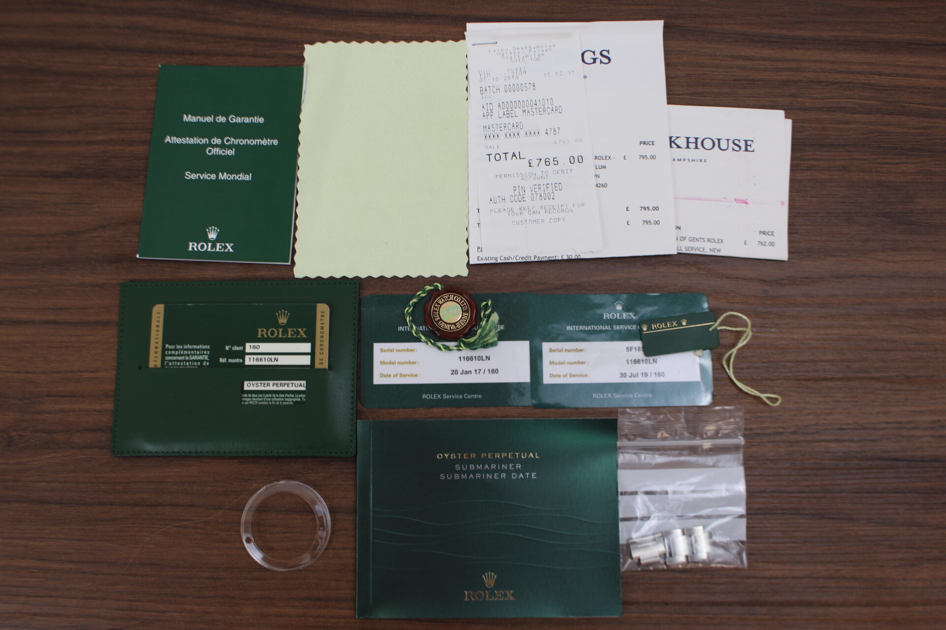 Rolex Submariner Date 40mm 116610LN warranty cards, service card, booklets, swing tags and original purchase receipt