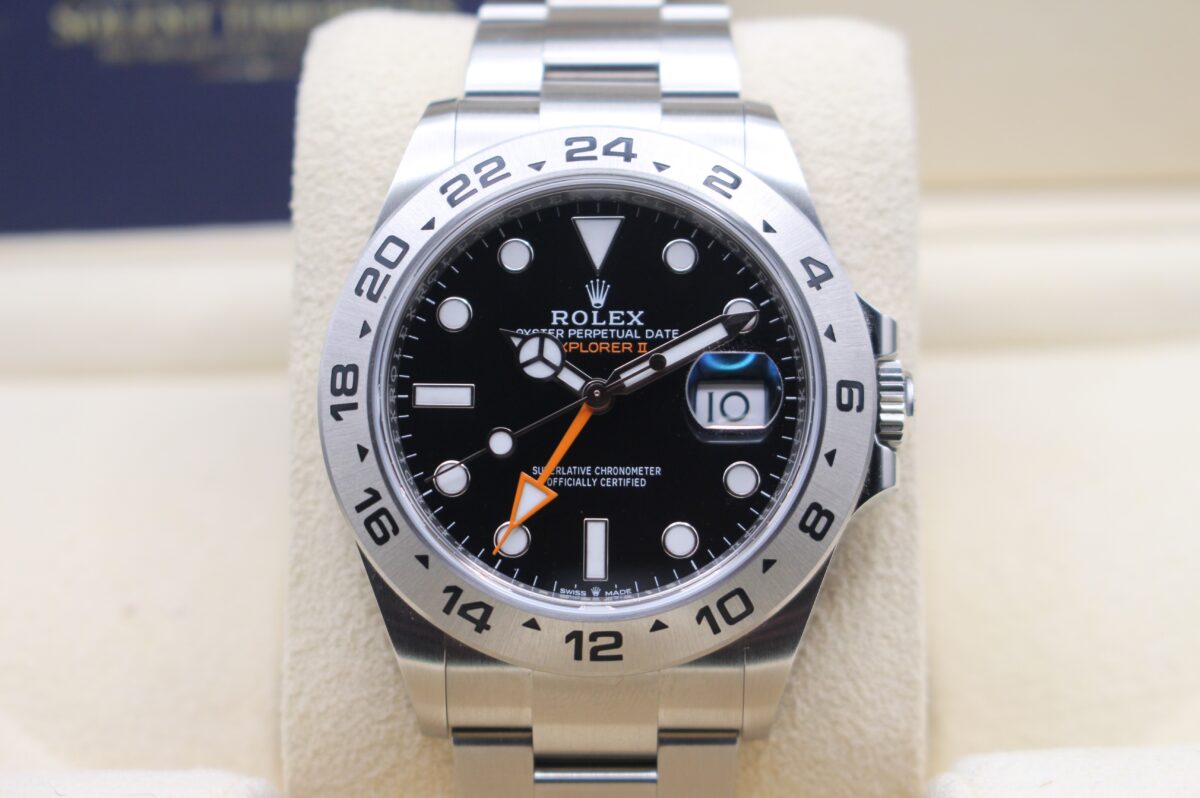 Rolex Explorer 2 black dial watch sat upright on its cushion