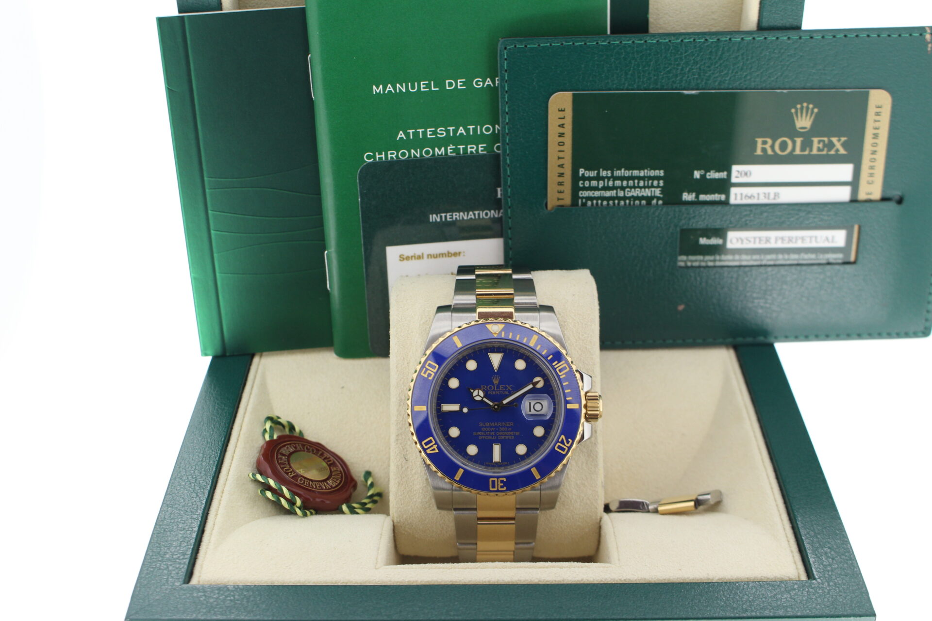 Rolex Submariner Bluesy 40mm 116613LB in it's box with red swing tags, booklets and warranty card