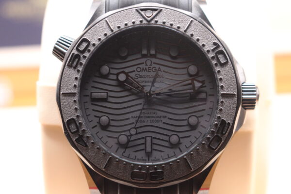 Close up shot of the Omega Seamaster black wave dial