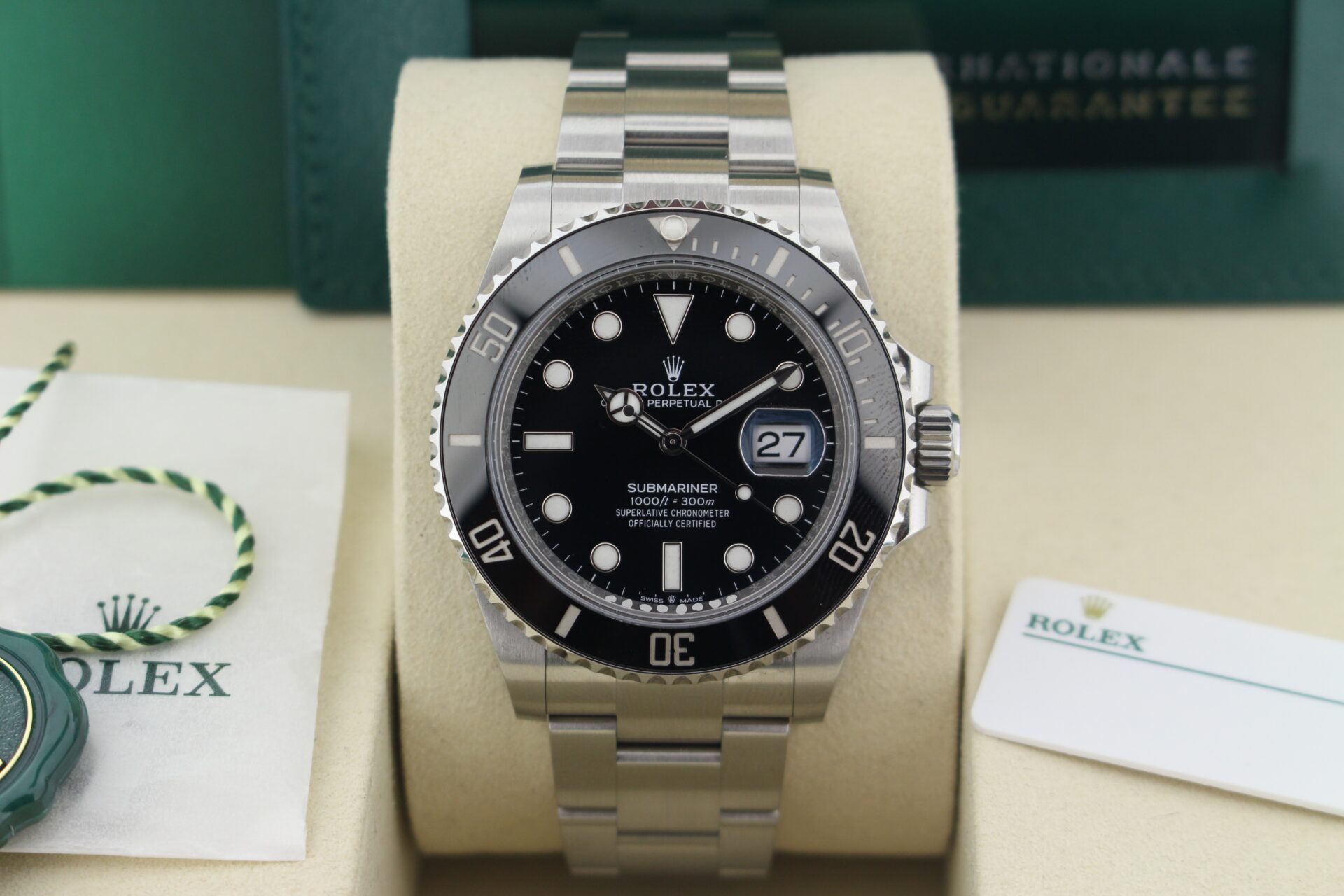 Close up of Rolex Submariner Date 41mm 126610LN in it's box with both swing tags, booklets and warranty card