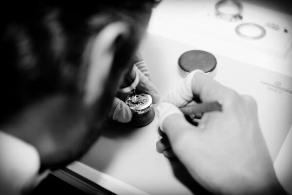 Watchmaker working on a automatic watch movement