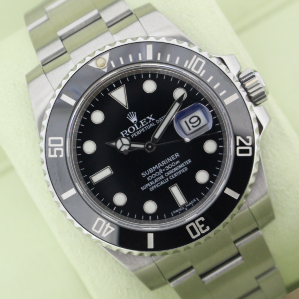 Rolex Submariner Date 116610LN in it's box with both red and green swing tags, booklets and warranty card