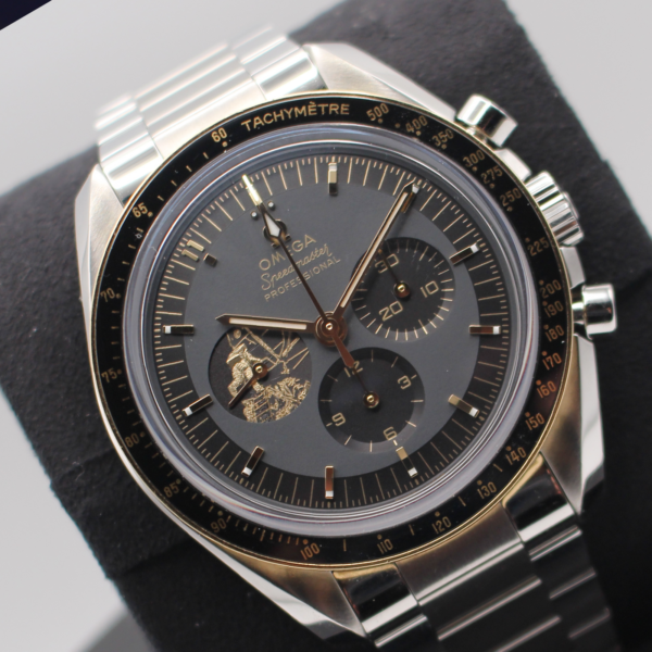 Omega Speedmaster Apollo 11 50th Anniversary Limited Edition, tilted backward on watch cushion, showing 10:10 time