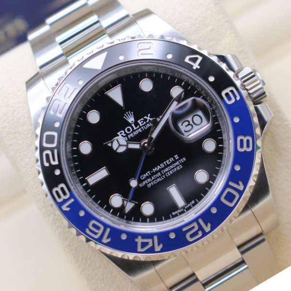 Rolex GMT Master II Batman 116710BLNR at a angle on its cushion