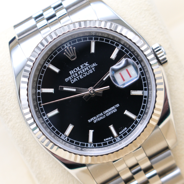 Rolex 116234 36mm Datejust at an angle reading 12 past 10